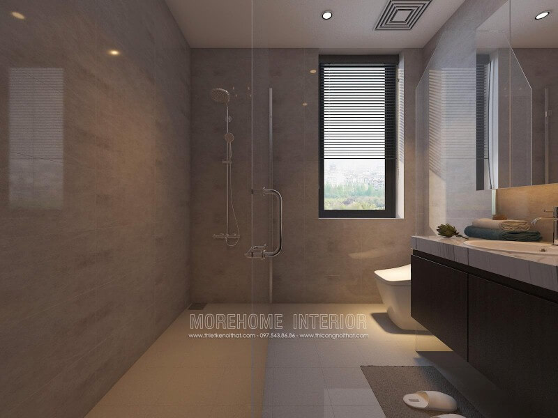 Thiết kế nội thất phòng tắm nhỏ đẹp sang trọng với vách tắm kính 135 độ song song với không gian vệ sinh từ tủ, gương và bồn cầu.