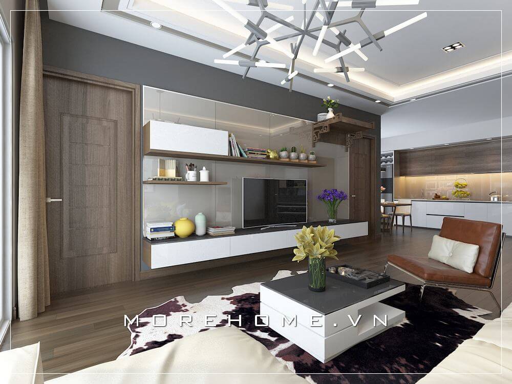 Thiết kế phòng khách kết hợp giữa tone đối sánh giữa trắng và nâu trầm của gỗ óc chó tạo vẻ đẹp độc đáo cho phòng khách căn hộ chung cư. Thiết kế nội thất