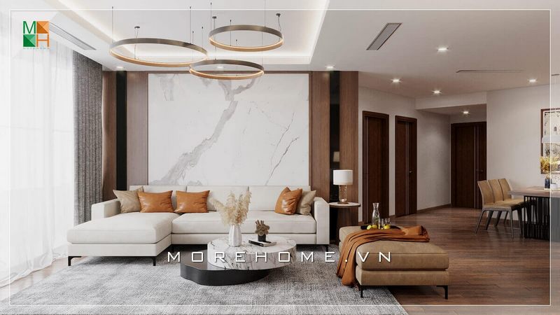 . Một bộ sofa gỗ bọc nỉ chữ L, một bàn trà bằng đá nhân tạo cùng đèn thả kiểu cách, và vách tường đá kết hợp gỗ, tất cả đã tạo nên một căn phòng khách đẹp mắt và tinh tế, thể hiện được gu thẩm mỹ của gia chủ.