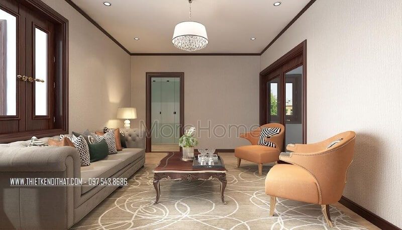 Sofa khung gỗ tự nhiên nhập khẩu bọc vải màu sữa được kết hợp với một chiếc bàn trà bằng gỗ tự nhiên mài nâu socola, cùng với hai chiếc ghế nghỉ màu cam để tạo nên sự sinh động mà không bị chật chội.